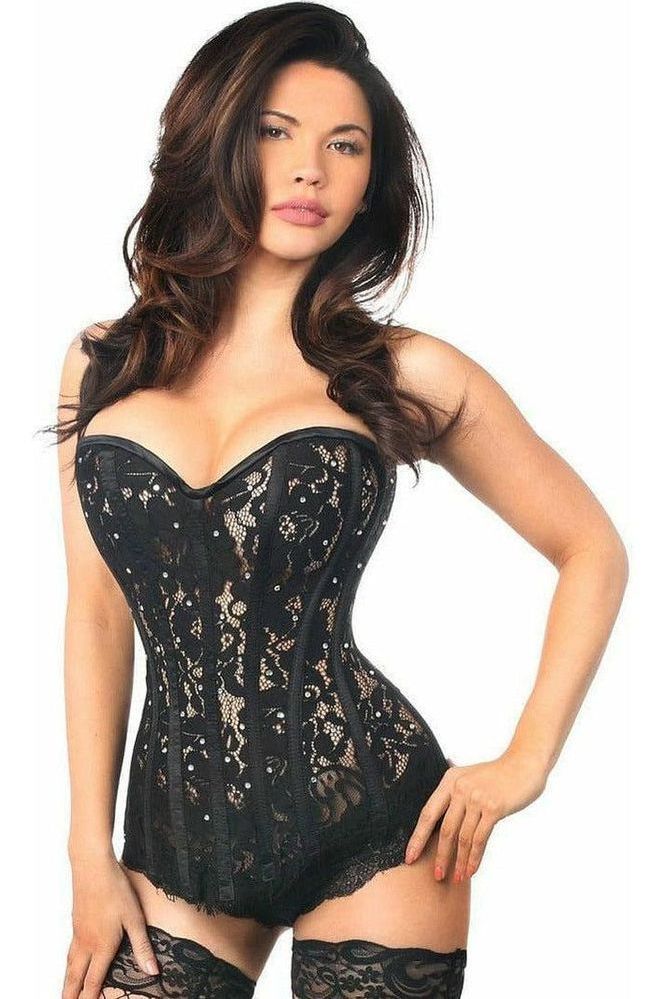 Woman wearing a black lace corset on a white background