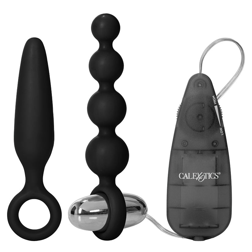 Black and silver adult product set with remote control on a white background
