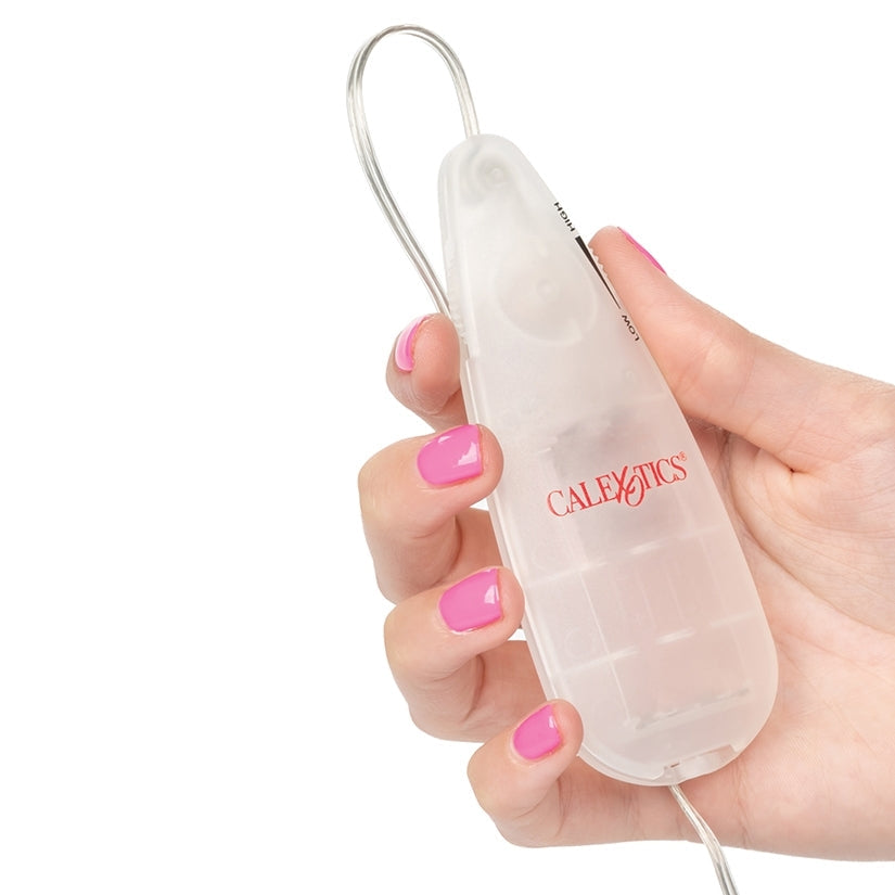 Hand holding a clear plastic device with 'Calexotics' branding on a white background