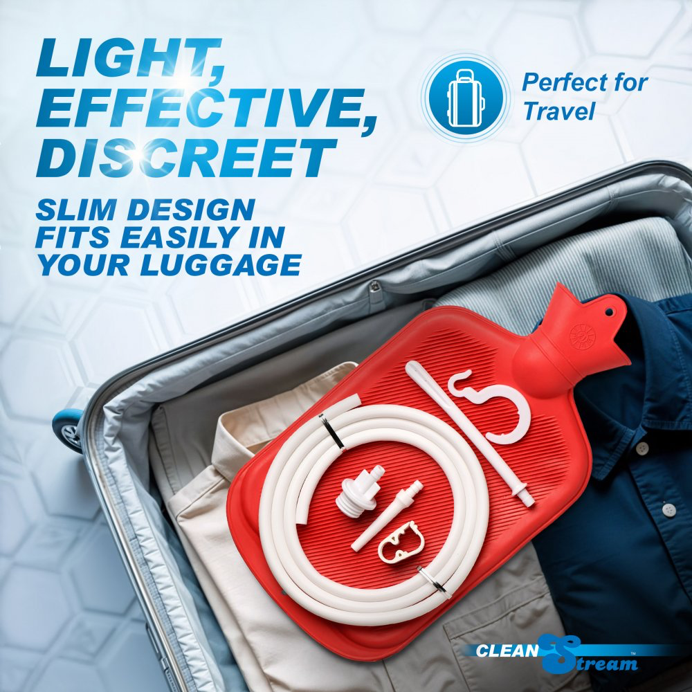 A red and white hot water bottle travel kit with a hose and connectors, shown inside an open suitcase alongside folded clothing. Large promotional text reads 'LIGHT, EFFECTIVE, DISCREET' and 'SLIM DESIGN FITS EASILY IN YOUR LUGGAGE,' with a 'Perfect for Travel' badge and a CLEAN STREAM logo in the corner.