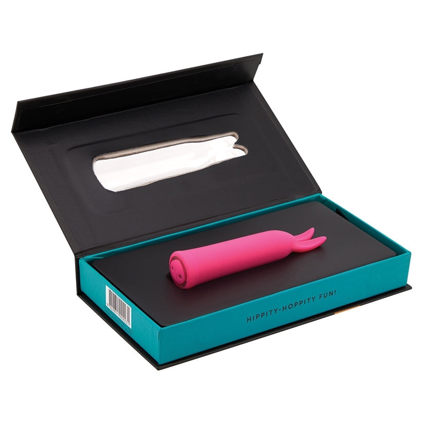 Pink novelty item in a black and teal box on a white background